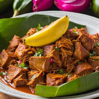  Cochinita Pibil:  เนื้อหมูชุ่มฉ่ำถูกปรุงด้วยเครื่องเทศและห่อใบ banana ก่อนนำไปย่าง!