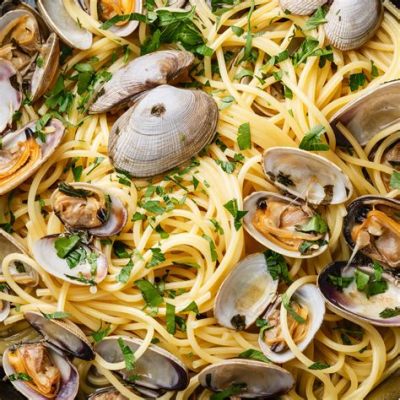   Spaghetti alle Vongole: A symphony of briny shellfish and al dente pasta awaits you in the heart of Urbino!